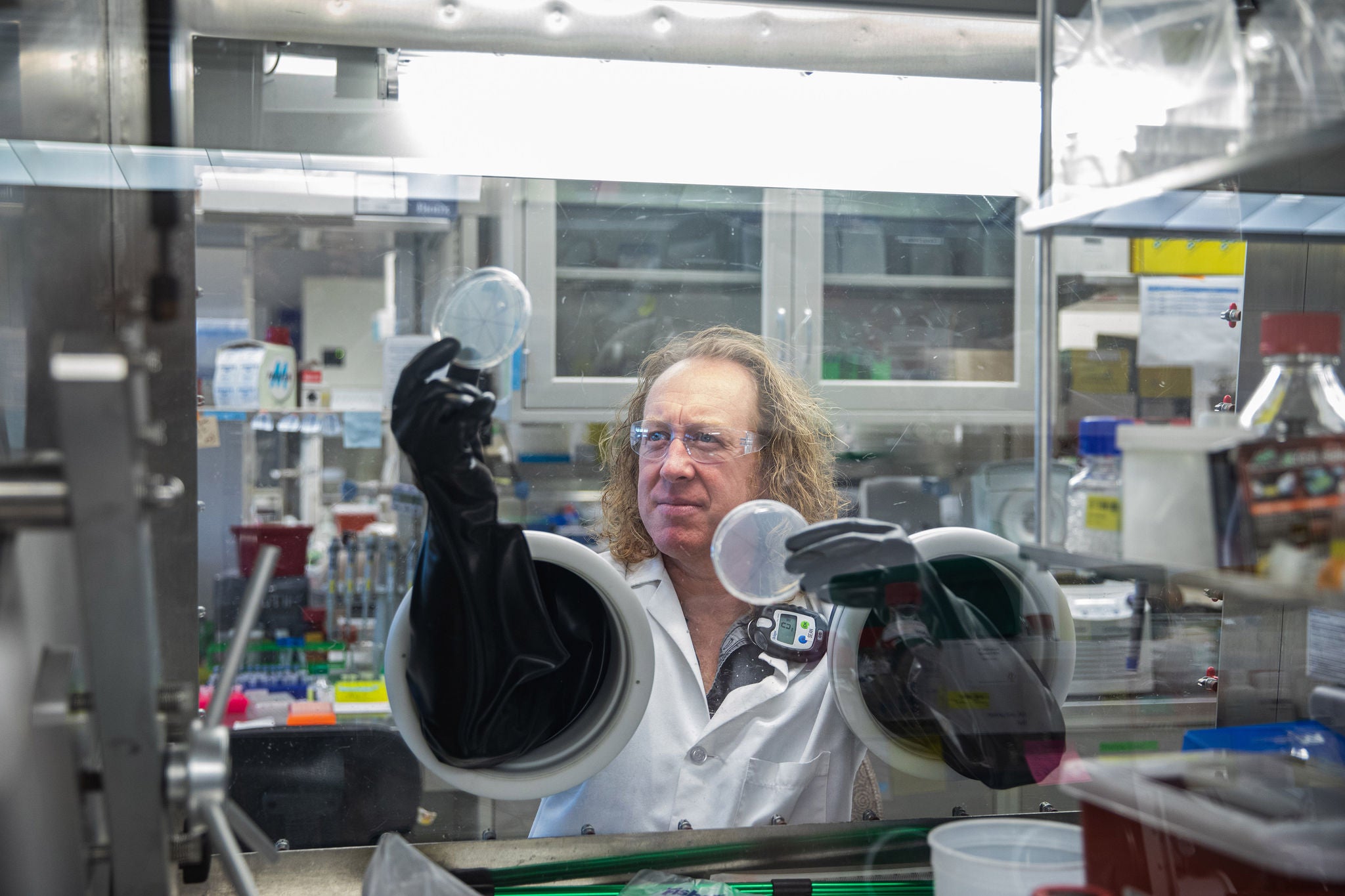 Sean Simpson examines samples in the lab