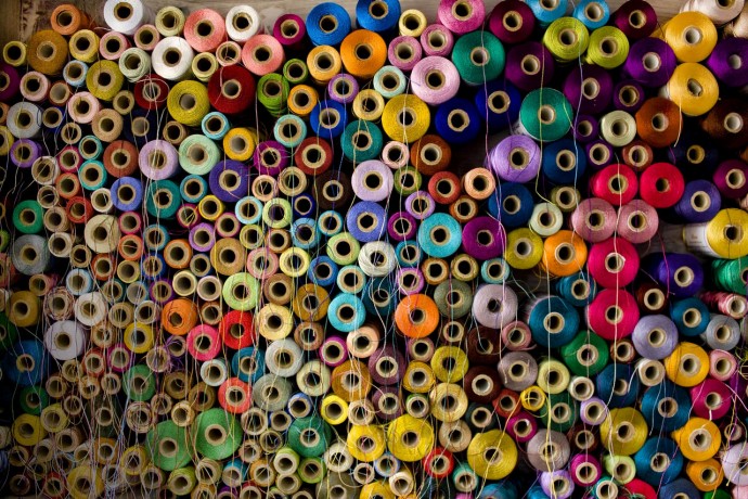 Colorful stack of cotton thread-reels